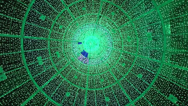 Modern christmas tall artificial tree from inside. View of the changing light pattern creating a beautiful texture at night time. vigo galicia spain