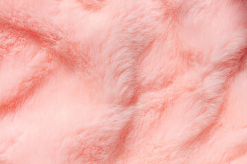 Pink fur texture top view. Coral fluffy fabric coat background. Winter fashion color trends feminine flat lay, female blog backdrop for text signs desidgn. Girly abstract wallpaper, textile surface.