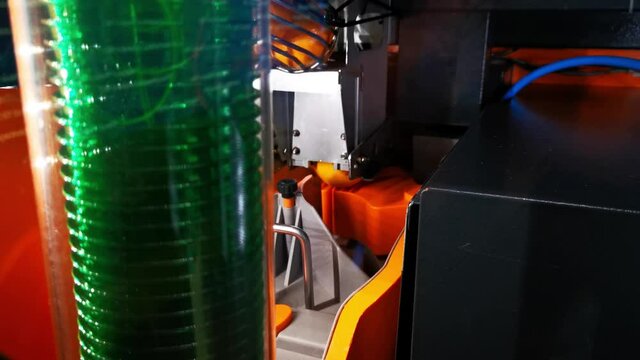 Orange juice machine oing through the process of selecting and cutting oranges