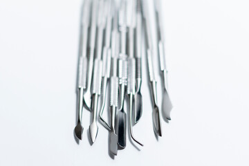 Collection of nail tools in the middle of the frame. Special shovels and hatchets.