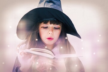 Halloween Witch girl with magic Book of spells portrait, young woman in witches hat conjuring, making witchcraft.
