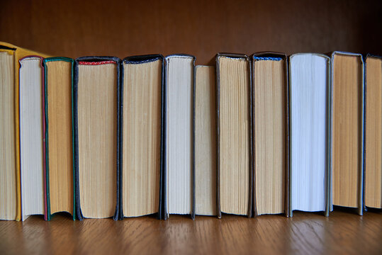 Book Spines Lined Up, Close-up, Learning And Education Concept.