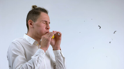 Shot of exploding balloon. Balloon's bang after man blowing it up.