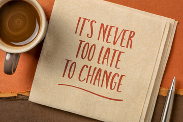 It is never too late to change - inspirational handwriting on a napkin, personal development concept