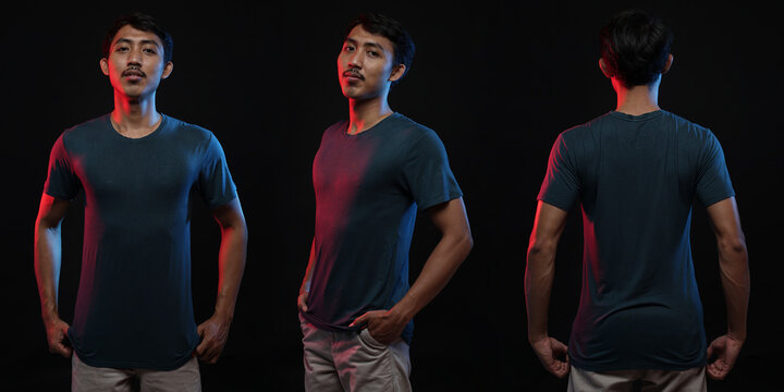 Young male in blank blue T-shirt, front and back view, isolated black background. Design men tshirt template and mockup for print