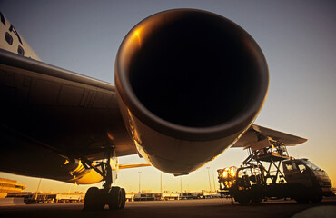 Close-up on jet engine at sunset