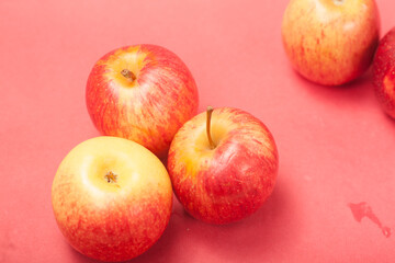 apples on a red background
