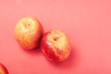 apples on a red background