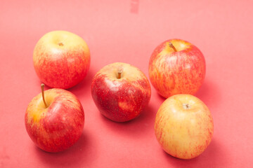 apples on a red background