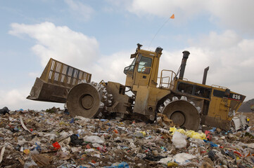 Excavator loader at dumping ground