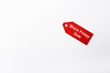 Top view of price tag with black friday sale lettering on white background