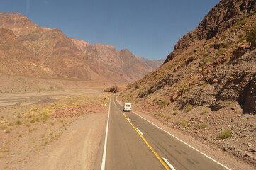 Fototapeta na wymiar Driving and hiking in the Andes Mountains between Chile and Argentina on the way to Mendoza