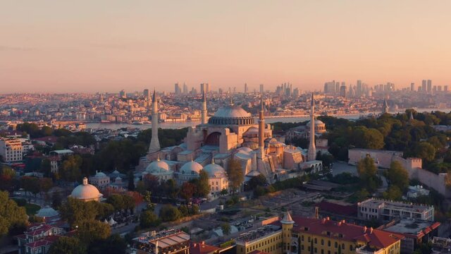 Istanbul, Hagia Sophia Grand Mosque (Ayasofya) with a Golden Horn on the background at sunset. Aerial view