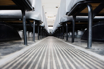 Aisle between seats in empty school bus