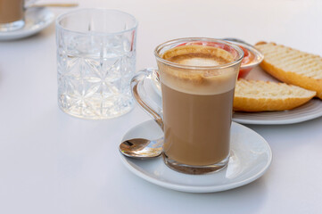 A BREAKFAST CUP WITH MILK COFFEE