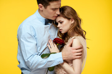 romantic couple in love with red flower hugging each other cropped view Copy Space