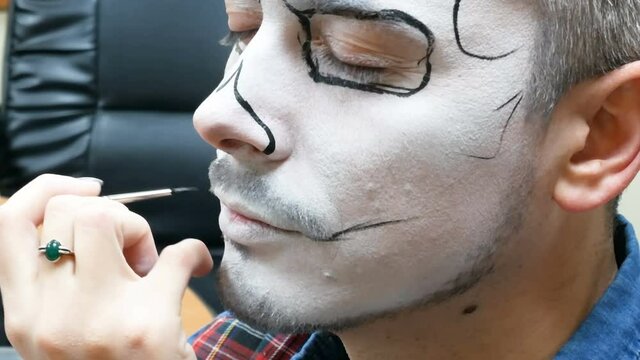 portrait of man with traditional mexican halloween makeup, caballero celebrating day of the dead, face art, body art, closeup