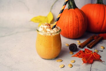 Homemade Pumpkin spice Smoothie /Latte on fall autumn background, selective focus