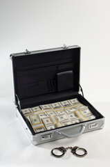 Suitcase With Dollars And Handcuffs