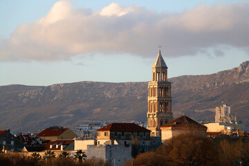 Fototapeta na wymiar Saint Domnius bell tower, a historical landmark in Split, Croatia, illuminated by warm sunset light. 