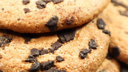 Soft, freshly baked chocolate chip cookies on a gray marble kitchen countertop. American traditional sweet pastry pastry, delicious homemade dessert. Culinary background. Close-up