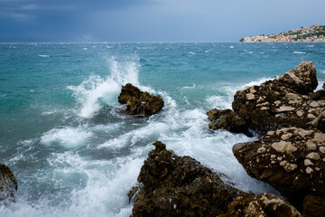 wild sea after storm with dark blue sea, rocky sea shore, zivogosce, croatia