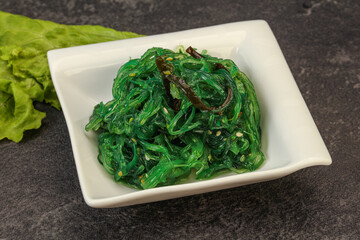 Green Chuka Seaweed Salad Isolated on White Background Top View. Wakame Sea Kelp Salat