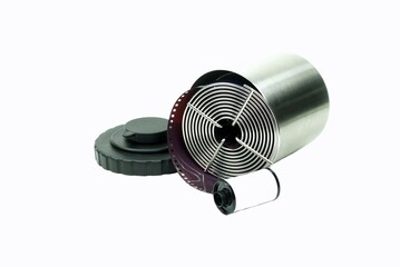 Close-Up a angle of inclination view stainless reel with film loaded and film canister to preparing for develope processing.