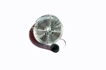 Close-Up a front view stainless reel with film loaded and film canister to preparing for develope processing.