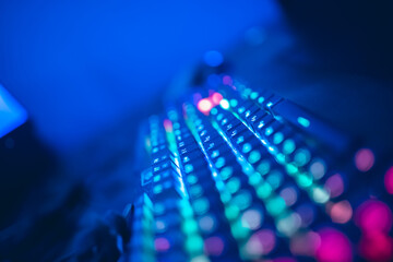 Banner professional cyber gamer studio room with keyboard in neon color blur background. Soft focus