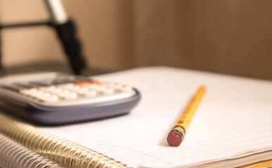 calculator and pencil studying math