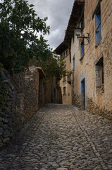 Fototapeta na wymiar Cobbled streets and stone houses in the medieval village of Mirambel, Teruel , Spain