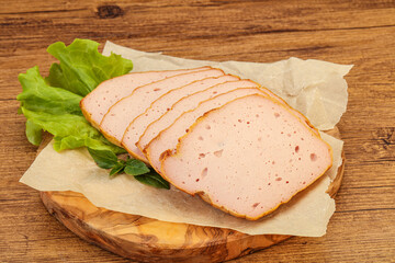 Boiled pork sausage over board