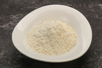 Wheat flour heap in the bowl