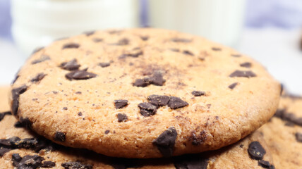 Soft, freshly baked chocolate chip cookies on a gray marble kitchen countertop. American traditional sweet pastry pastry, delicious homemade dessert. Culinary background. Close-up