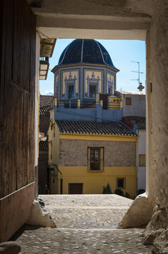 Tiled dome of the Parish Church of Our Lady of the Assumption through a porch, Onda, Castellon, Spain