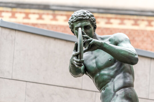 Bronze statue of Discobolus by Mathieu Kessels in the sculpture garden of the Rijksmuseum in Amsterdam, the Netherlands.