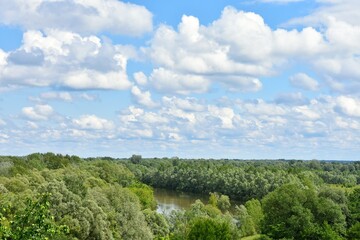 Fototapeta premium Landscape view of the Seim River (Ukraine), surrounded by trees and meadows near wooden Cossack fortress, Baturin, Ukraine