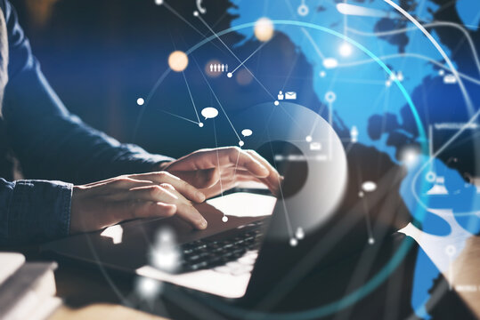 Male hands with laptop. Man working remotely at home. Concept of networking or remote work. Global business network. Online courses.