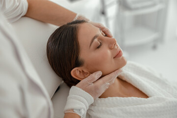 Beautiful healthy smiling caucasian woman is doing beauty procedures at spa and healthcare salon