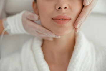 Beautiful healthy smiling caucasian woman is doing beauty procedures at spa and healthcare salon