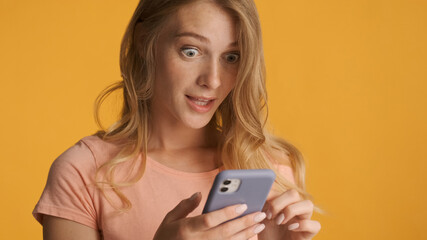 Close up amazed girl texting with friend in online chat on smart