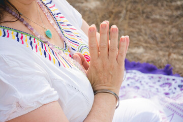 Hands of woman meditating