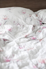 Fototapeta na wymiar Messy bed blankets quilt 
