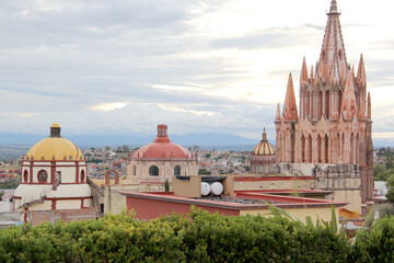 Naklejka premium view of dome and towers of cathedral and town of San Miguel de Allende in Guanajuato Mexico