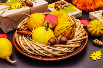 Autumn table design with crafted gift boxes, fall decor and fragrant candles