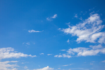 White clouds float across the blue sky.