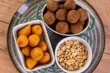 Mix of fried savory snack with coxinha, kebab and roasted and salted peanuts