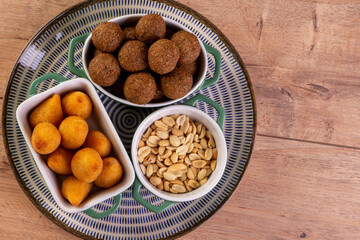 Mix of fried savory snack with coxinha, kebab and roasted and salted peanuts
