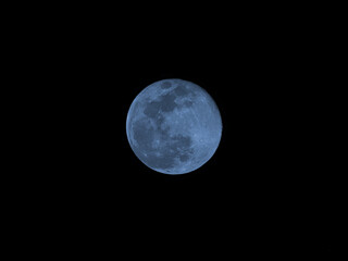 Naklejka na ściany i meble Blue moon of Halloween also called Harvest moon twice in month of October a full moon glowing in night sky 